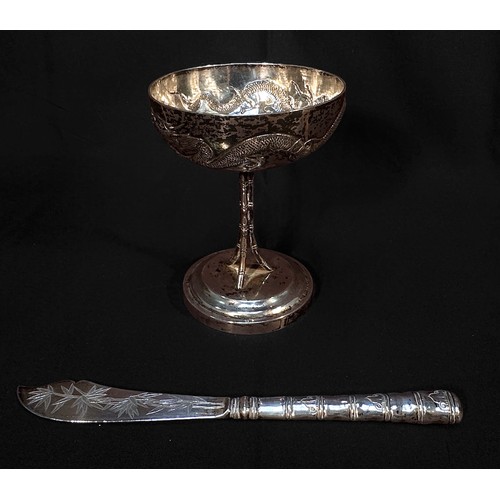 56 - A Chinese Export Silver goblet, with shallow circular bowl embossed and chased with a dragon, the bo... 