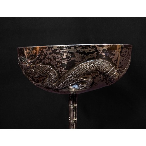 56 - A Chinese Export Silver goblet, with shallow circular bowl embossed and chased with a dragon, the bo... 