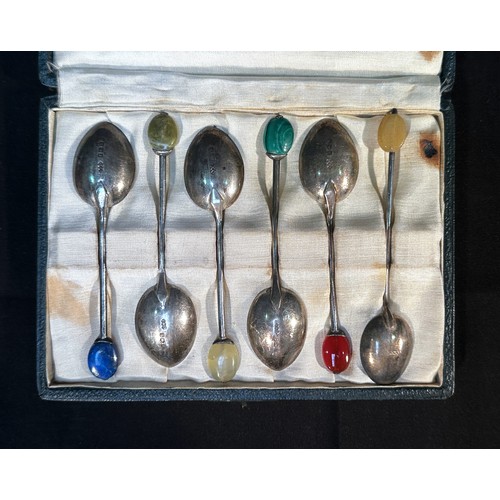 78 - A part set of five silver coffee spoons by Liberty & Co, with hardstone finals including malachite, ... 