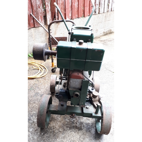 384 - A Lister stationary petrol engine, manufactured by R.A.Lister & Co Ltd, Dursley, England, with belt-... 