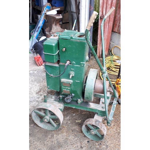 384 - A Lister stationary petrol engine, manufactured by R.A.Lister & Co Ltd, Dursley, England, with belt-... 