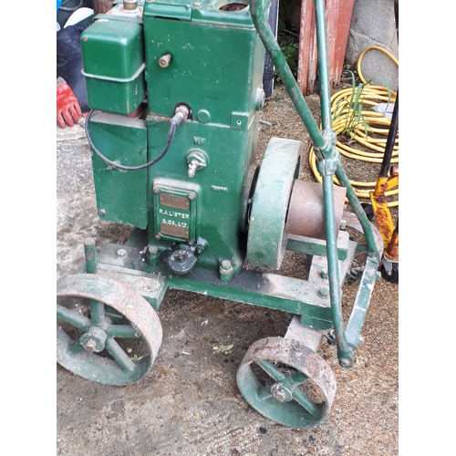 384 - A Lister stationary petrol engine, manufactured by R.A.Lister & Co Ltd, Dursley, England, with belt-... 