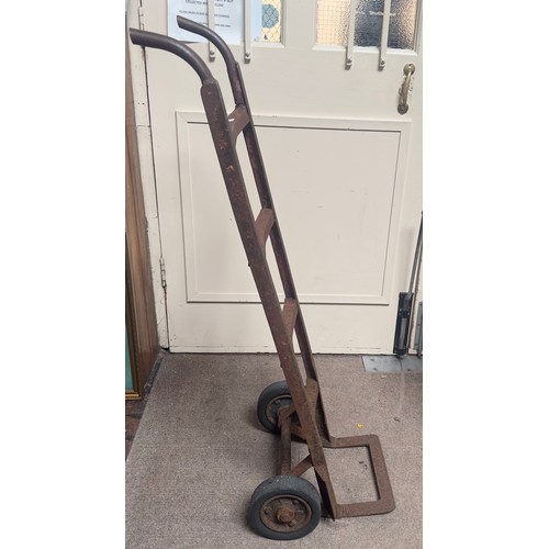 378 - A vintage iron sack truck with some residue red paint