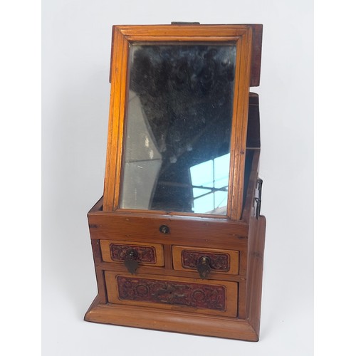 375 - A Chinese portable vanity box, with adjustable easel mirror with three carved drawers beneath, toget... 