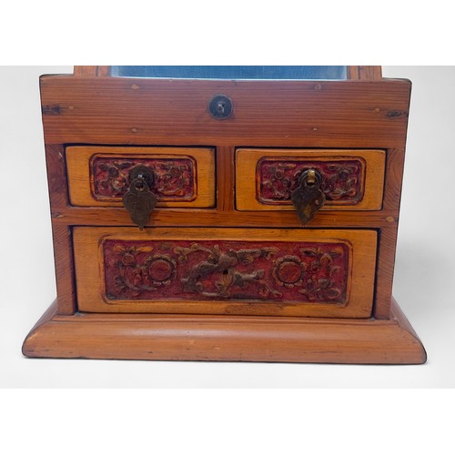 375 - A Chinese portable vanity box, with adjustable easel mirror with three carved drawers beneath, toget... 