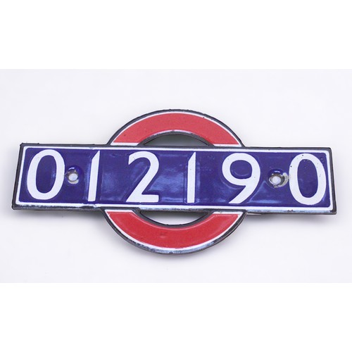 397 - A London Underground enamel bullseye stocknumber identification plate, in the form of the iconic sil... 