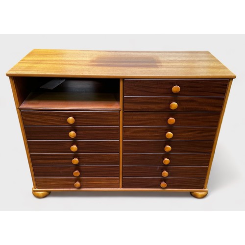 635 - A mahogany and teak sideboard containing 14 drawers with turned pulls and pigeonhole, by John Austin... 