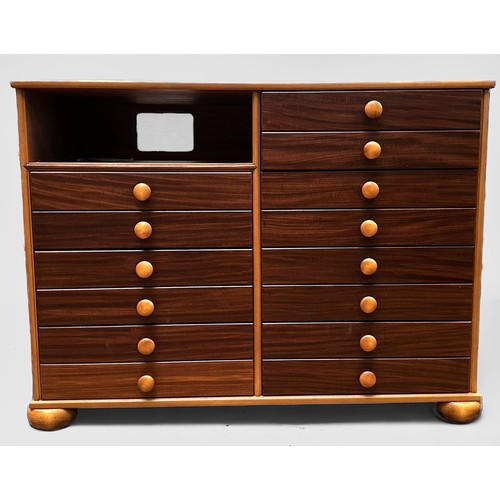 635 - A mahogany and teak sideboard containing 14 drawers with turned pulls and pigeonhole, by John Austin... 