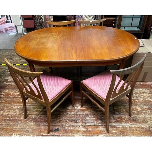 636 - A G-Plan oval extending dining table and four rosewood chairs, (some fading) together with a contemp... 