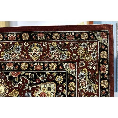 534 - A Persian rug, probably silk and wool, central medallion to a cream field with spandrels, multi bord... 