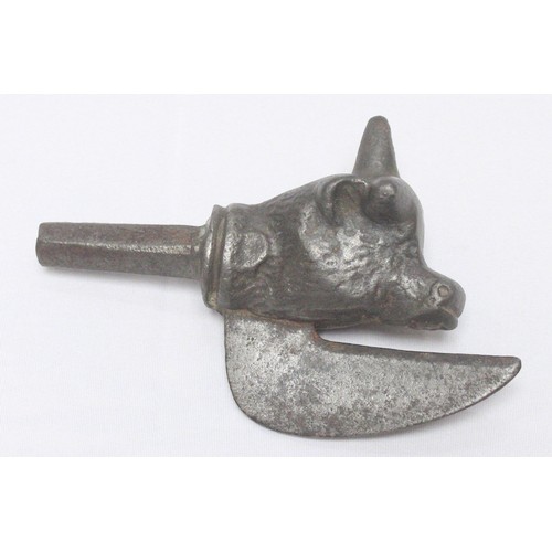 422 - A 19th century 'bronzed' iron Greyhound paper-clip with glass eyes, together with an iron novelty do... 