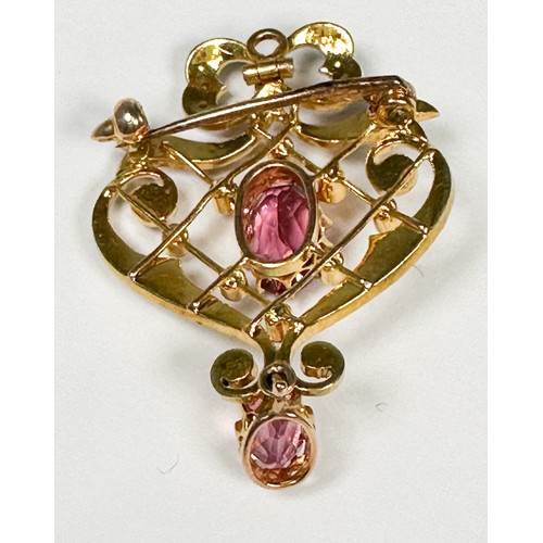 150 - A 15ct yellow gold pendant, claw-set with an oval-shaped pink topaz to the centre, surrounded by see... 