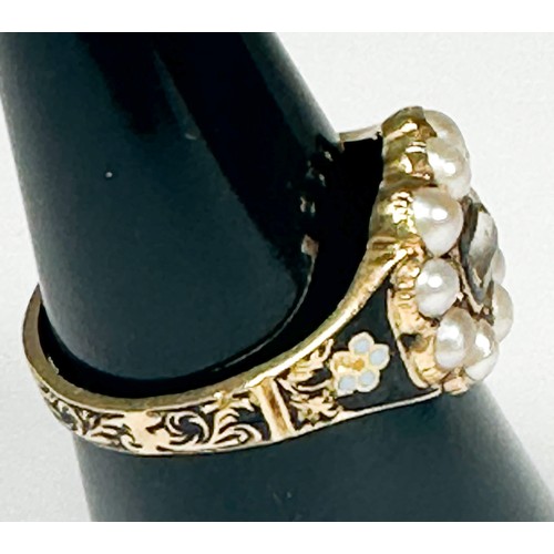 151 - An 18ct yellow gold and enamel mourning ring, set with ten seed pearls to the top, weighs 5.3 grams.