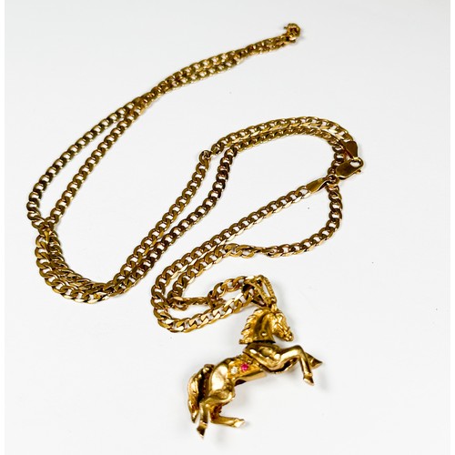 194 - A 9ct gold curb-link chain with articulated horse pendant, total weight 27.5 grams.