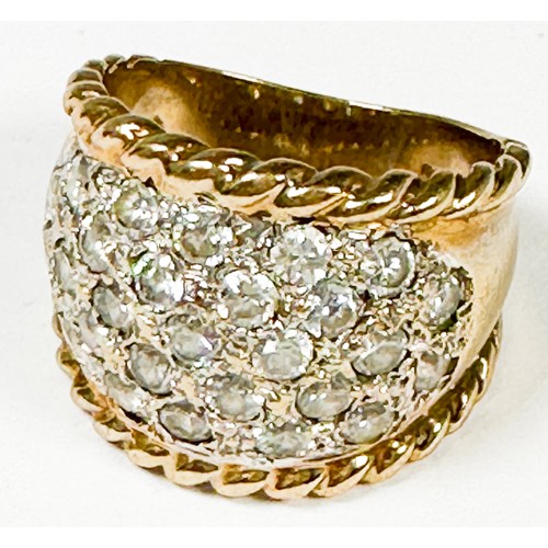 196 - A 9ct yellow gold wide band dress ring, set with white faceted stones, weight 6.9 grams.