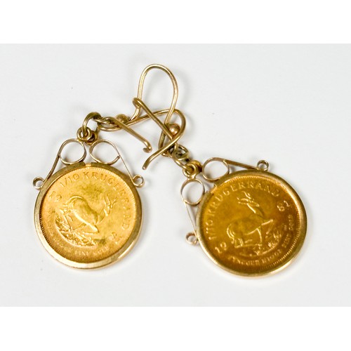 202 - A pair of 22ct gold 1/10th Kruggerand earrings, on 9ct gold wires, total weight 8.8 grams.