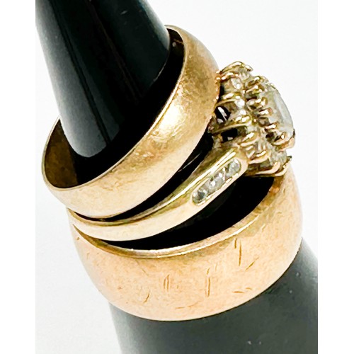 204 - Two 9ct gold wedding rings, together with a 9ct gold dress ring, set with white faceted stones in a ... 