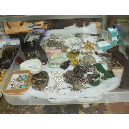 221 - A good quantity of costume jewllery including brooches, earrings, rings, buckles etc, in two clear p... 