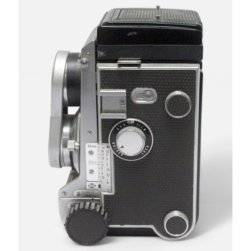 511 - A Mamiya C3 Professional Medium Format TLR Camera, with two 80mm 1:2.8 lenses and branded lens cap