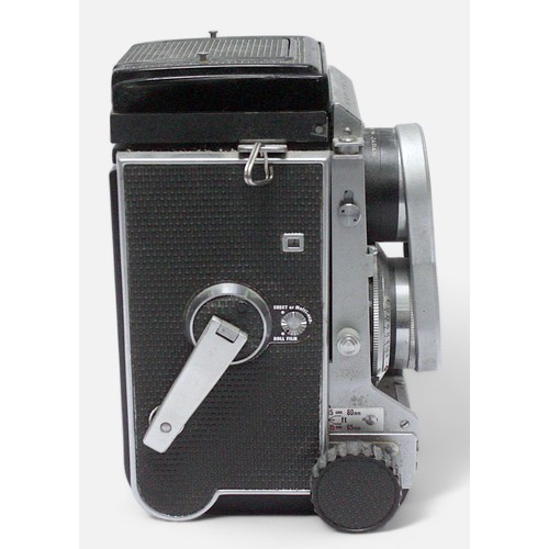 511 - A Mamiya C3 Professional Medium Format TLR Camera, with two 80mm 1:2.8 lenses and branded lens cap