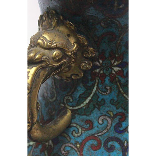 63 - An early 20th century Chinese cloisonne enamel vase, of baluster form with gilt-brass elephant handl... 