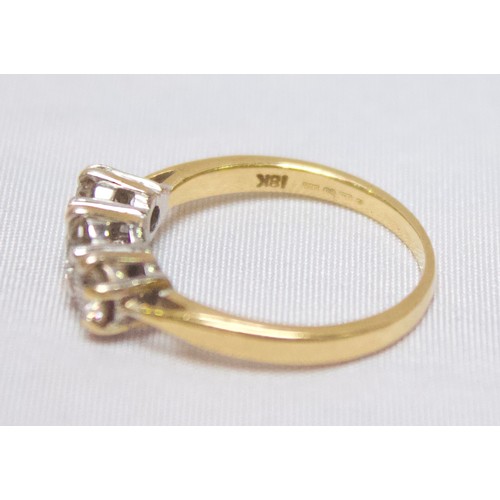 268 - An 18ct yellow gold and three-stone diamond ring, claw-set three graduated RBC diamonds, estimated t... 