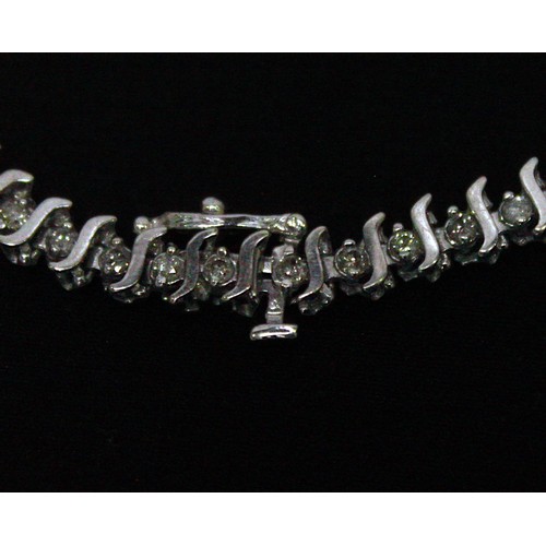 269 - A 14ct white gold and diamond line bracelet, claw-set with 55x RBC diamonds, estimated total diamond... 