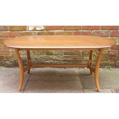 643 - An Ercol elm coffee table, of oval form, raised on downswept supports with stretcher, 115cm long