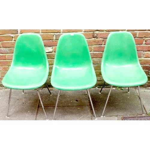 646 - Charles & Ray Eames for Herman Miller, three DSX shell chairs moulded from fibreglass in a green fin... 