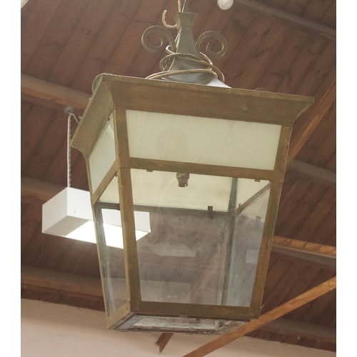 537 - A large painted metal lantern, with decorative scrolled finial and glass panelled sides (one side an... 