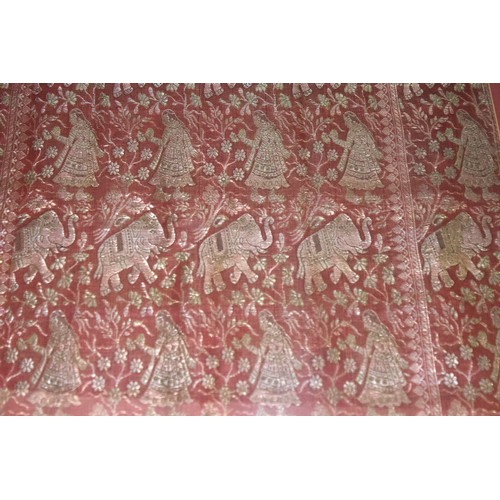 536 - An Indian gold embroidered rouge cotton panel worked with elephants and female figures, 60x53cm, mou... 