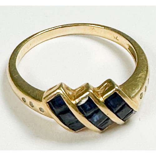 165 - An 18ct yellow gold dress ring, invisible set with three rows of three princess cut sapphires, ring ... 