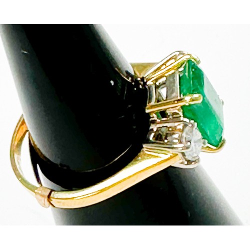 167 - An 18ct gold dress ring, four-claw set with a rectangular-shaped emerald, measuring approximately 10... 