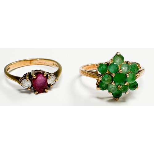 168 - A 9ct gold dress ring, in a three-tier cluster design, set with 13 x small emeralds, ring weighs 2.3... 