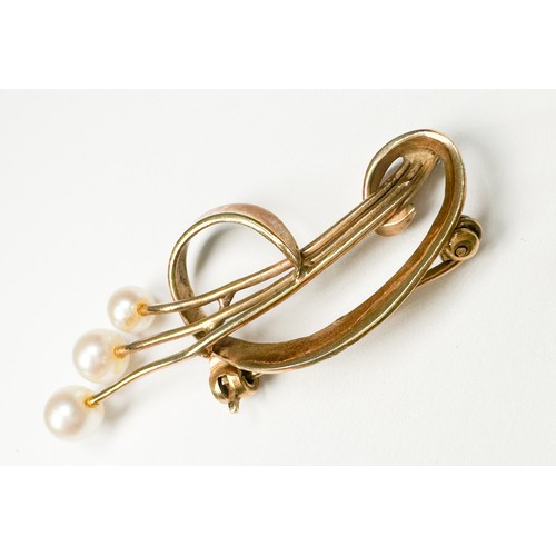 209 - A 9ct gold brooch with three cultured pearls in an open  spray design, weighs 3.6 grams.