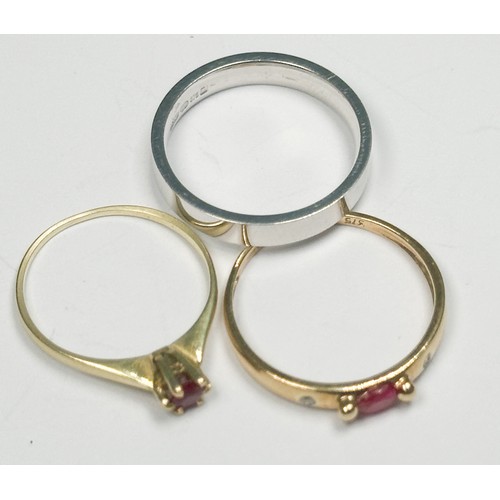 247 - A 14ct yellow gold dress ring, claw-set with a small ruby, together with a 9ct yellow gold ruby and ... 