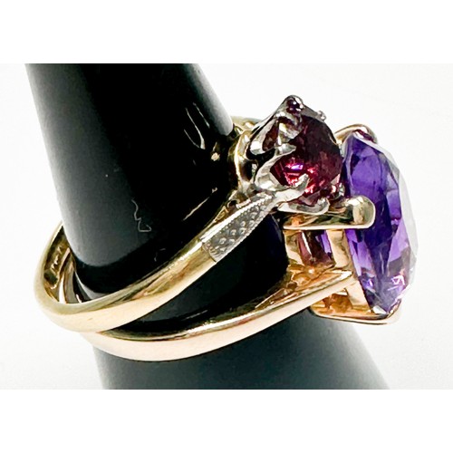 246 - A 9ct yellow gold dress ring, claw set with a large oval shaped amethyst, measuring 14mm x 12mm, tog... 