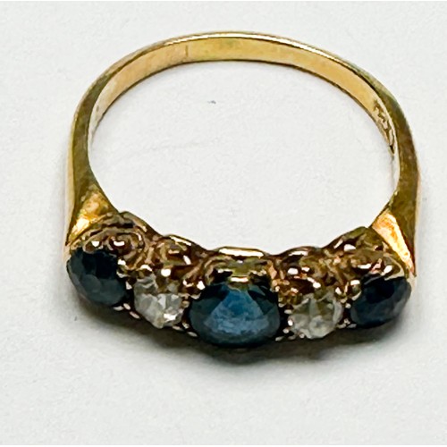 254 - An 18ct yellow gold sapphire and diamond ring, set with three faceted sapphires and two Victorian cu... 