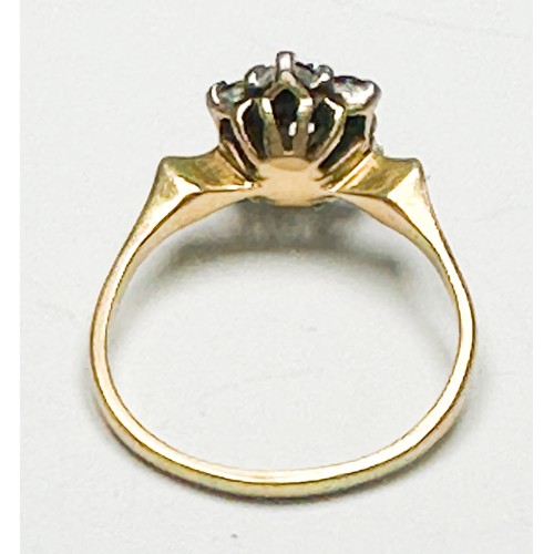 258 - An 18ct yellow gold dress ring, claw-set with a round diamond to the centre, surrounded by 6 x sapph... 