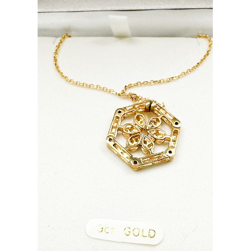 232 - A 9ct yellow gold pendant, set with small diamonds in a floral daisy design, articulated pendant can... 