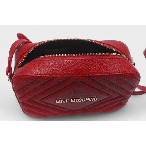 491 - A red leather Love Moschino cross body bag, with gilt lettering to front and strap with gilt hardwar... 