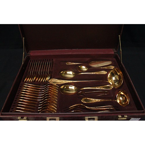 105 - An SBS Bestecke Solingen gold-plated cutlery set in branded fitted attaché case, across two tiers