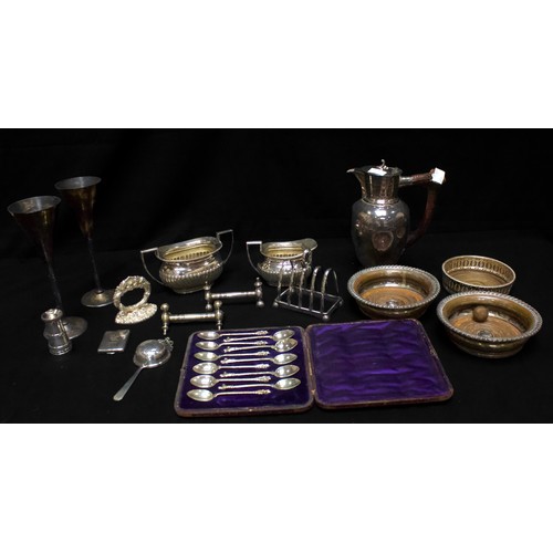 104 - A collection of assorted silver-plated wares including wine coasters, a teapot with spirit burner, t... 