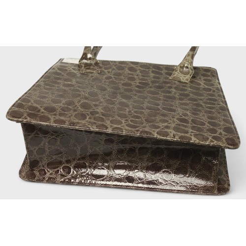 495 - A brown croc leather Dolce & Gabbana handbag, with stitched brand badge to front, polka dot interior... 