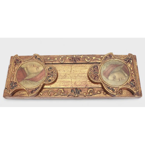 438 - A late 19th Century/early 20th Century gilt painted book slide, shaped incised ends with circular pr... 