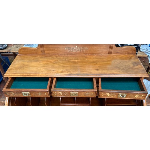 625 - A 20th Century brass inlaid hardwood bureau, cylinder front opens to reveal writing slide and pigeon... 