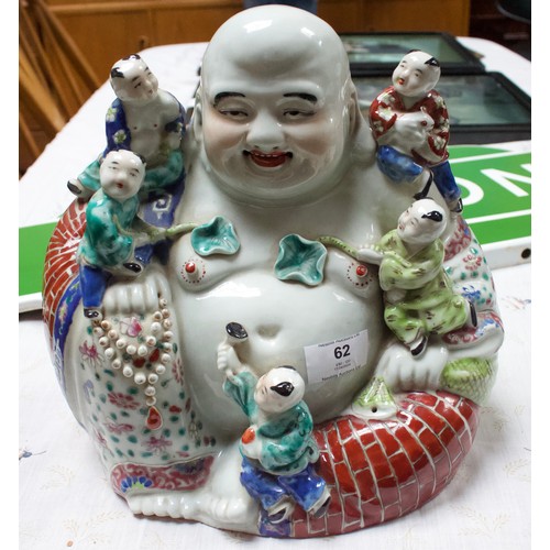 62 - A 20th Century Chinese porcelain figure of a seated laughing Buddha with children, painted in Famill... 