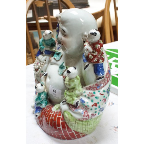 62 - A 20th Century Chinese porcelain figure of a seated laughing Buddha with children, painted in Famill... 