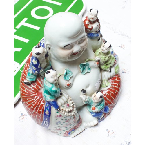 62 - A 20th Century Chinese porcelain figure of a seated laughing Buddha with children, painted in Famill... 