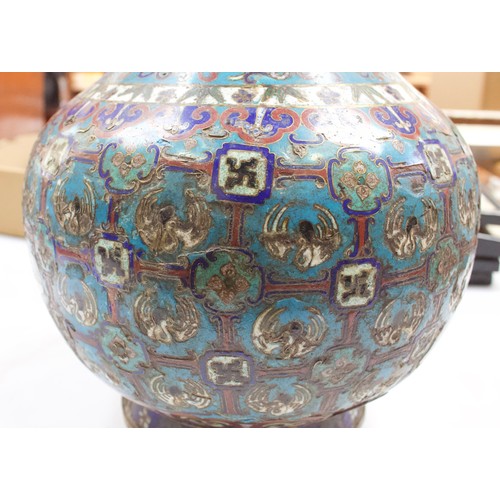 63 - An early 20th century Chinese cloisonne enamel vase, of baluster form with gilt-brass elephant handl... 